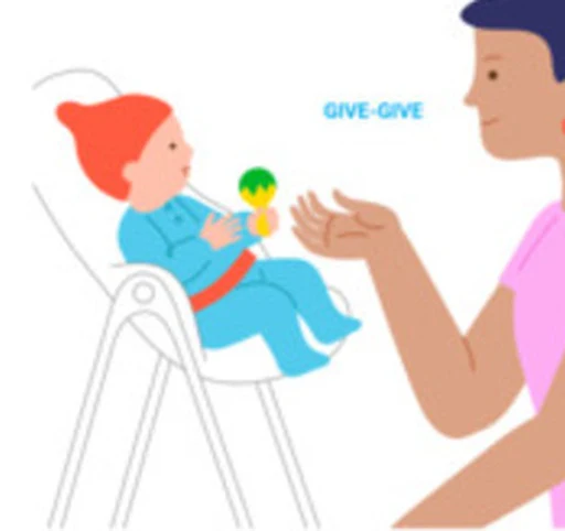 A baby reaches toward a toy offered by a caregiver.