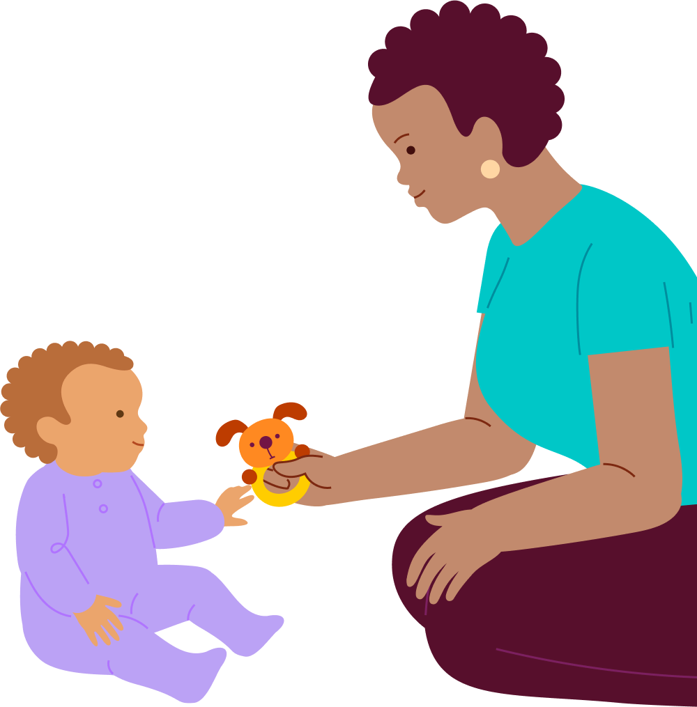 A toddler reaches for a small toy offered by an adult.