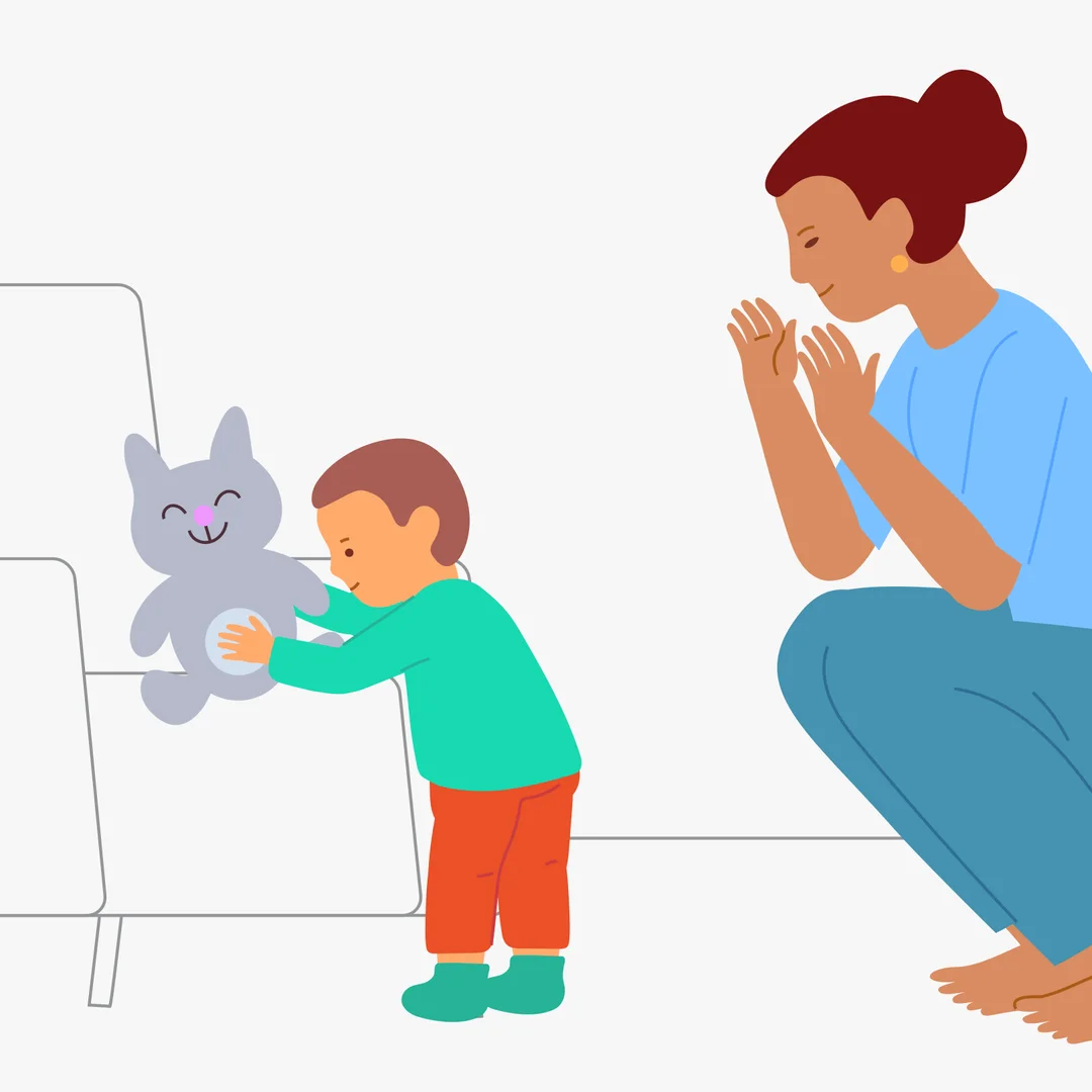 Illustration for “First Steps with a Moving Support”, step 4: When you reach the chair, say: “Sit the kitty down.”Praise the child: “Good job.