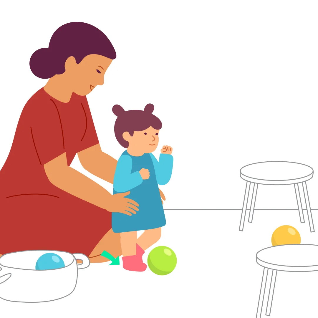 Illustration for “"Goal!"”, step 3: Take the second ball and put it in front of your child.