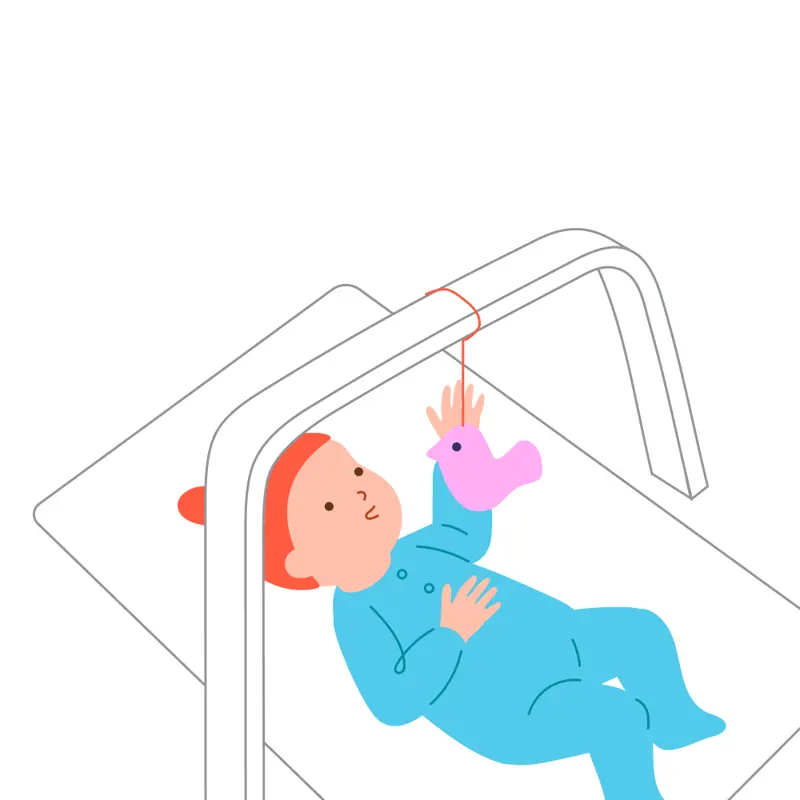 A baby lying on a floor mat reaches toward a securely attached toy on a play gym.
